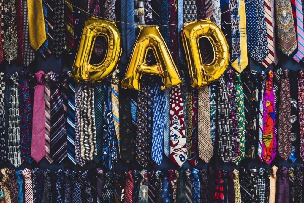 the word dad in golden balloon letters for fathers day