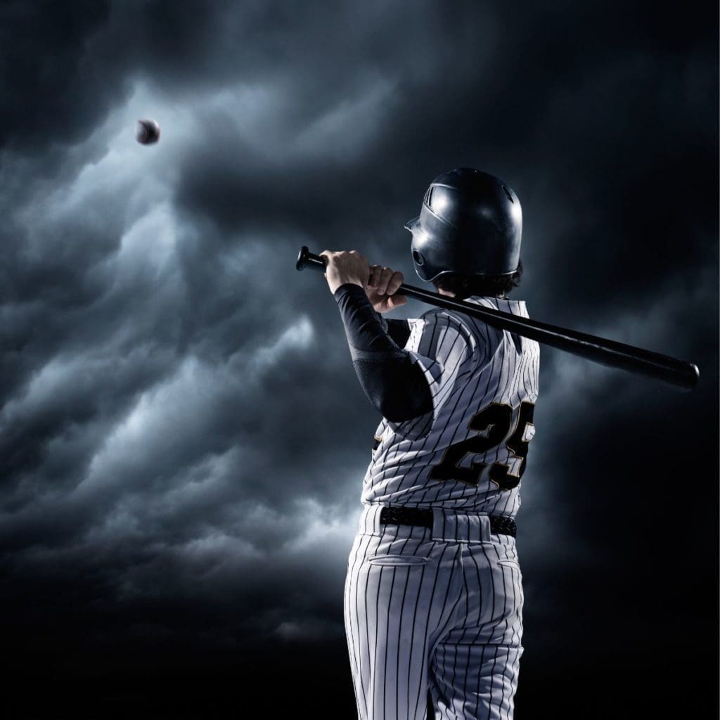 baseball player hitting a baseball into dark clouds. bag policy for MLB stadiums