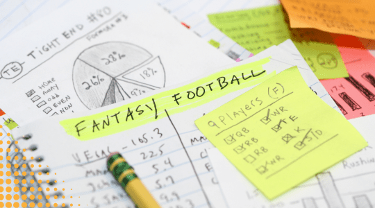 the words fantasy football highlighted on a notebook